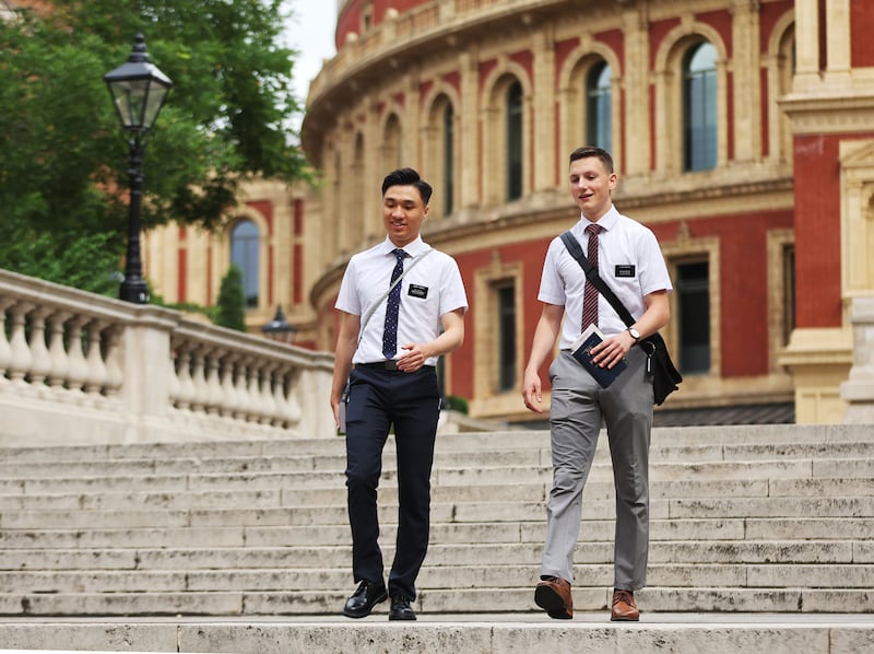 Elders Dallin Nevers and Moses Yeung walk in London.