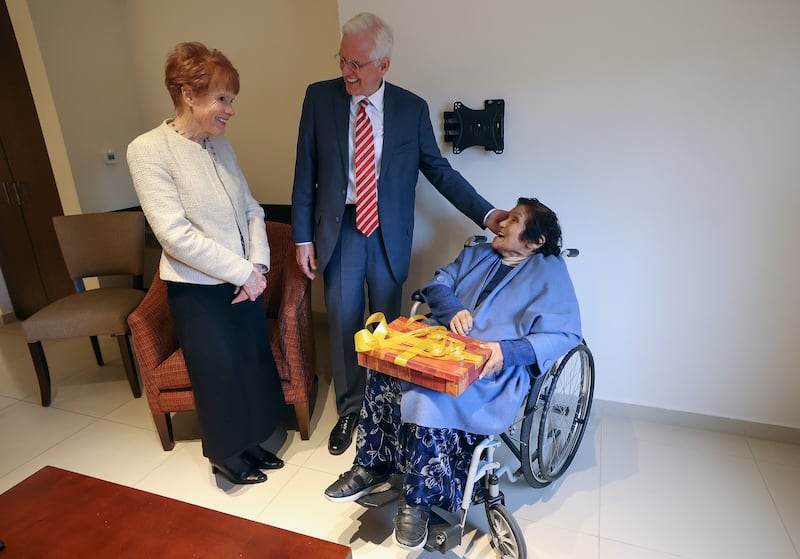 Sister Kathy Christofferson and Elder Todd Christofferson meet with Sergia Arce.