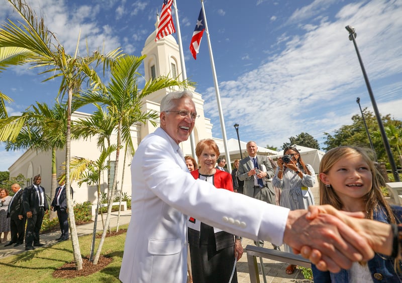 Elder D. Todd Christofferson shakes hands outside of the San Juan Puerto Rico Temple.