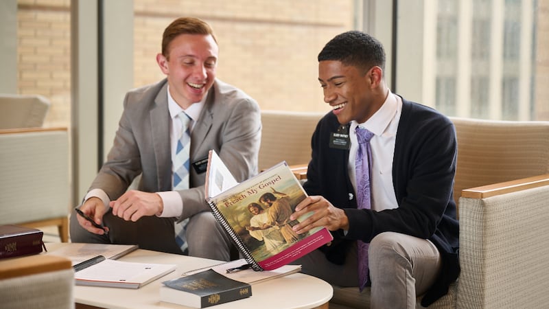 Missionaries at the Provo Missionary Training Center look through“Preach My Gospel: A Guide to Sharing the Gospel of Jesus Christ.”