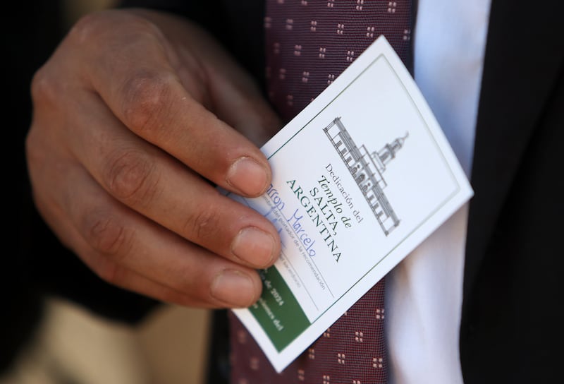 A man holds his ticket for the dedication of the Salta Argentina Temple.