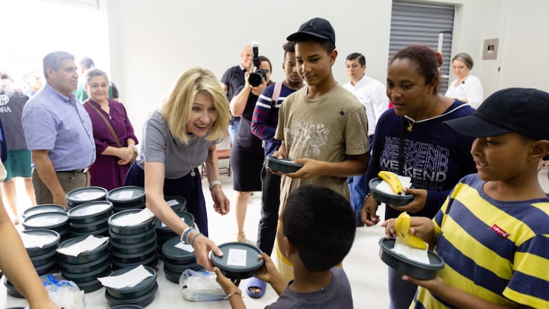 President Camille N. Johnson distributes lunches to displaced families in San Jose, Costa Rica.