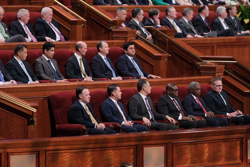 The 11 newly sustained General Authority Seventies sit on the stand during the Saturday morning session of April 2024 general conference.