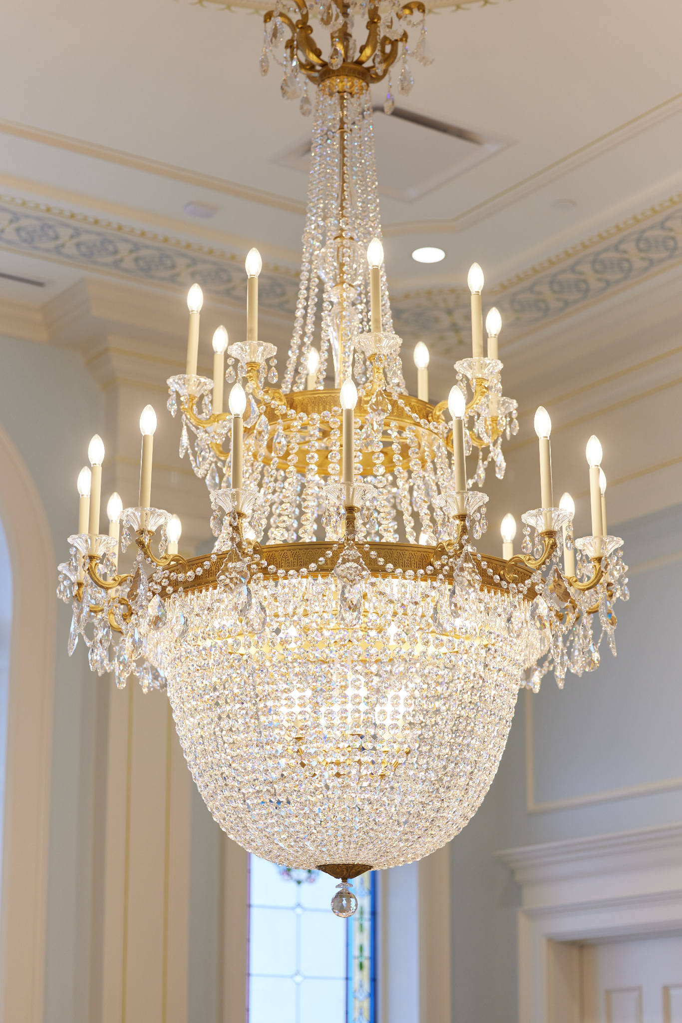 A close-up of a clear crystal chandelier.