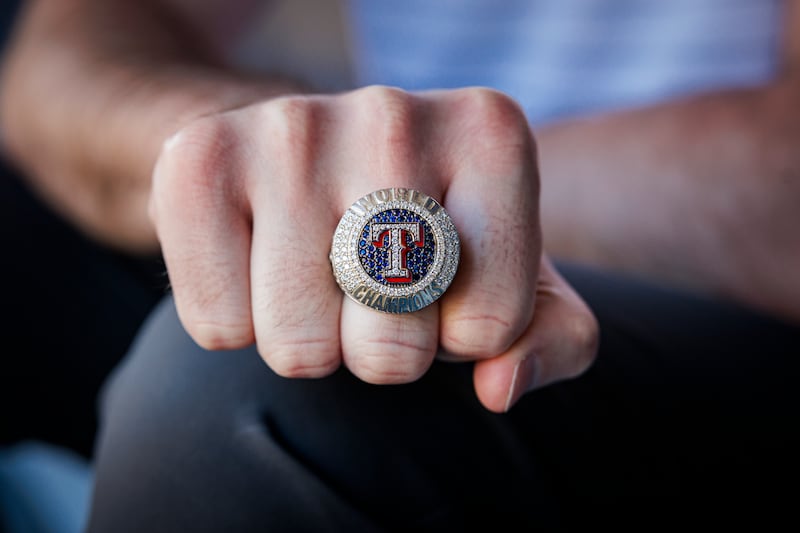 Will Melville shows off his Texas Rangers World Series ring.