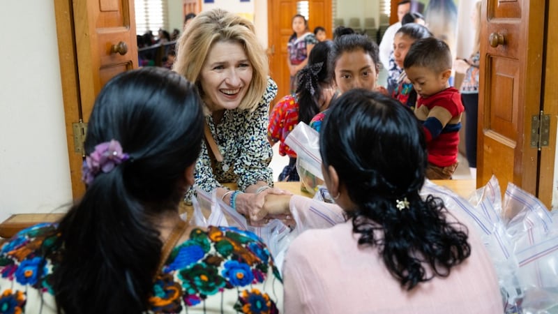 Relief Society General President Camille N. Johnson speaks with women in Chimaltenango, Guatemala
