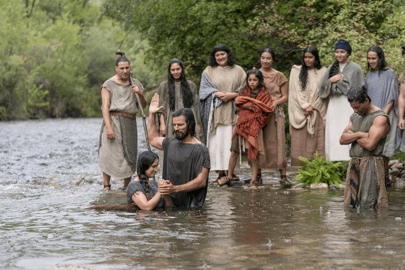 Alma the Younger baptizes a woman in this picture from the Book of Mormon Videos.