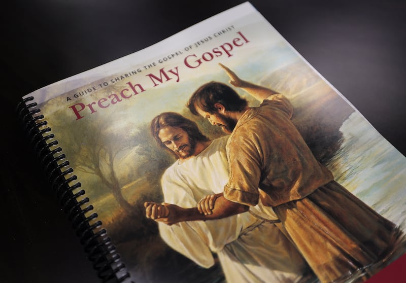 A copy of the second edition of the “Preach My Gospel” manual on a table.
