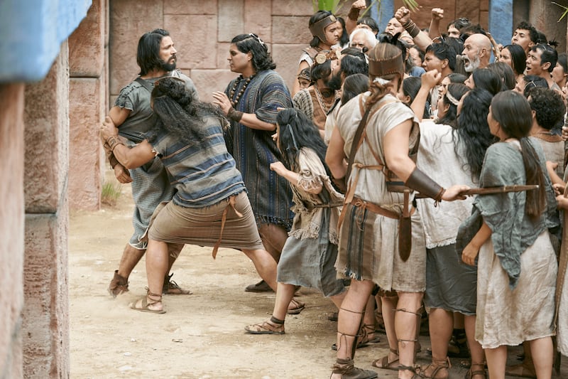 Alma the Younger is pushed away by a crowd in this picture from the Book of Mormon Videos.