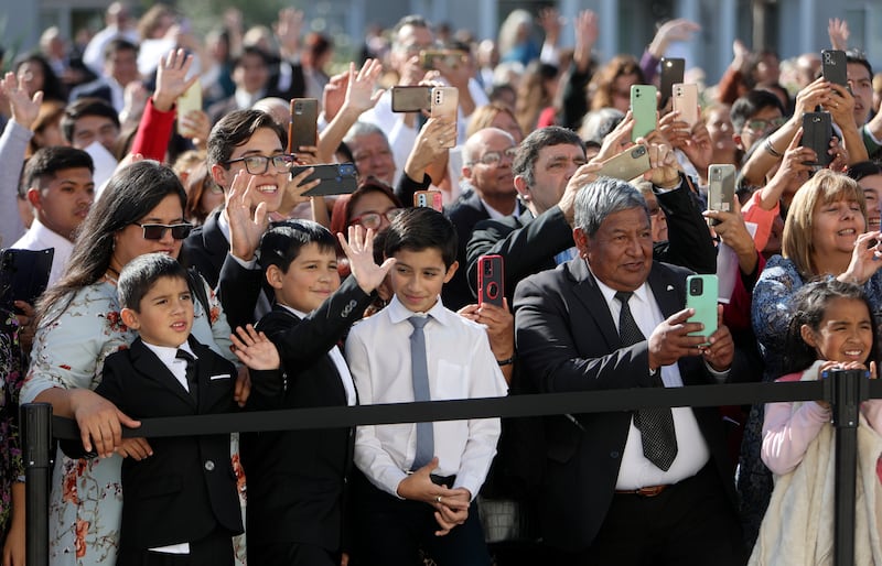 People wave to Elder Todd Christofferson as he leaves the Salta Argentina Temple.