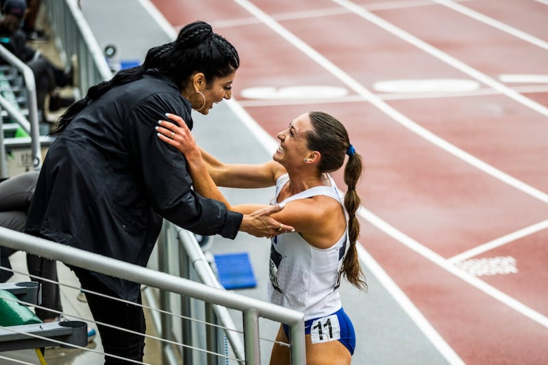 Latter-day Saint athlete Courtney Wayment celebrates with her coach, Diljeet Taylor, after winning the women’s steeplechase race on Saturday, June 11, 2022, during the 2022 NCAA track and field national championships in Eugene, Oregon.