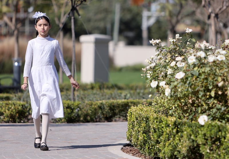 A young girl walks outside of the Salta Argentina Temple.