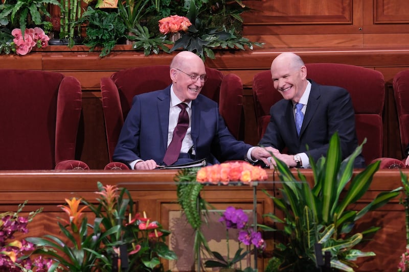 President Henry B. Eyring and Elder Dale G. Renlund share a moment during the Saturday evening session of April general conference.