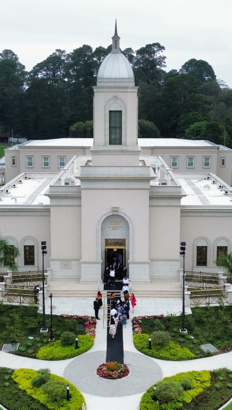 Church members make their way to the front doors of the temple for the dedication of the Cobán Guatemala Temple in Cobán, Guatemala.