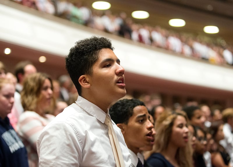 Kevin Dickson, 17, sings at the end of the Worldwide Devotional for Youth at the Conference Center in Salt Lake City on Sunday, June 3, 2018.