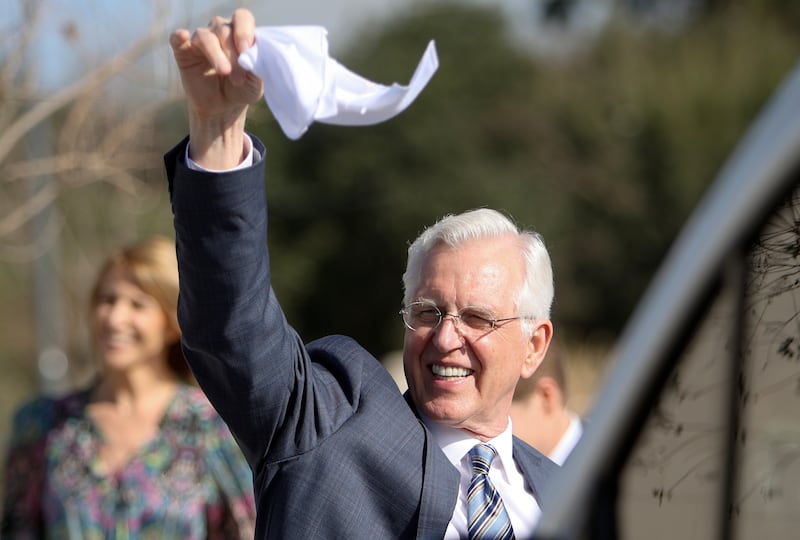 Elder Todd Christofferson waves a handkerchief as he leaves the Salta Argentina Temple.