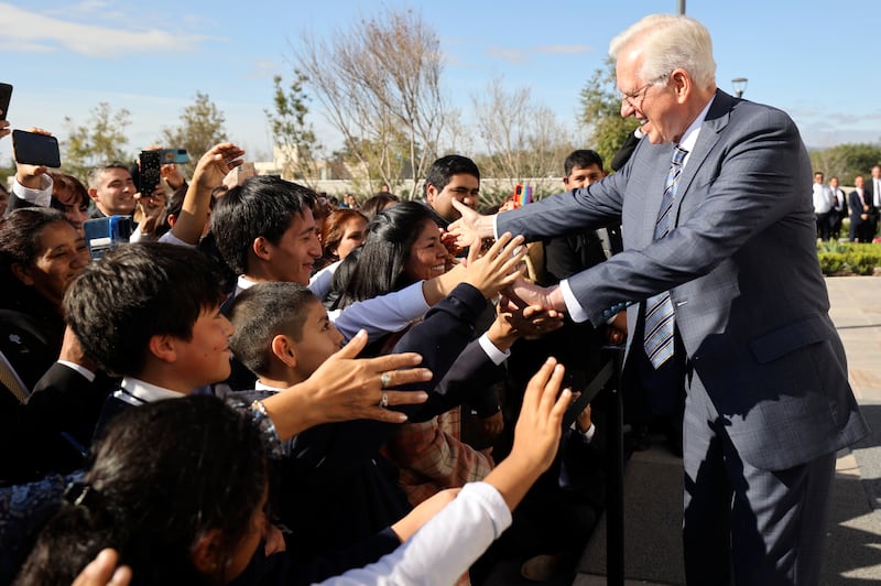 Elder Todd Christofferson greets the crowd after dedicating the Salta Argentina Temple.